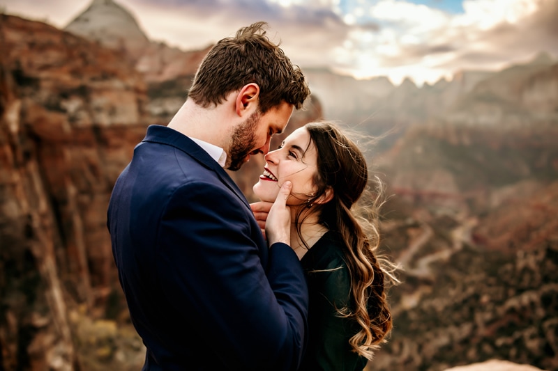 Vacation Photographer, man and woman gaze into each other's eyes before Zion
