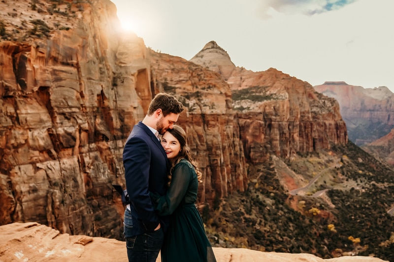 Elopement Photographer, a woman and man hold each other in Zion National Park