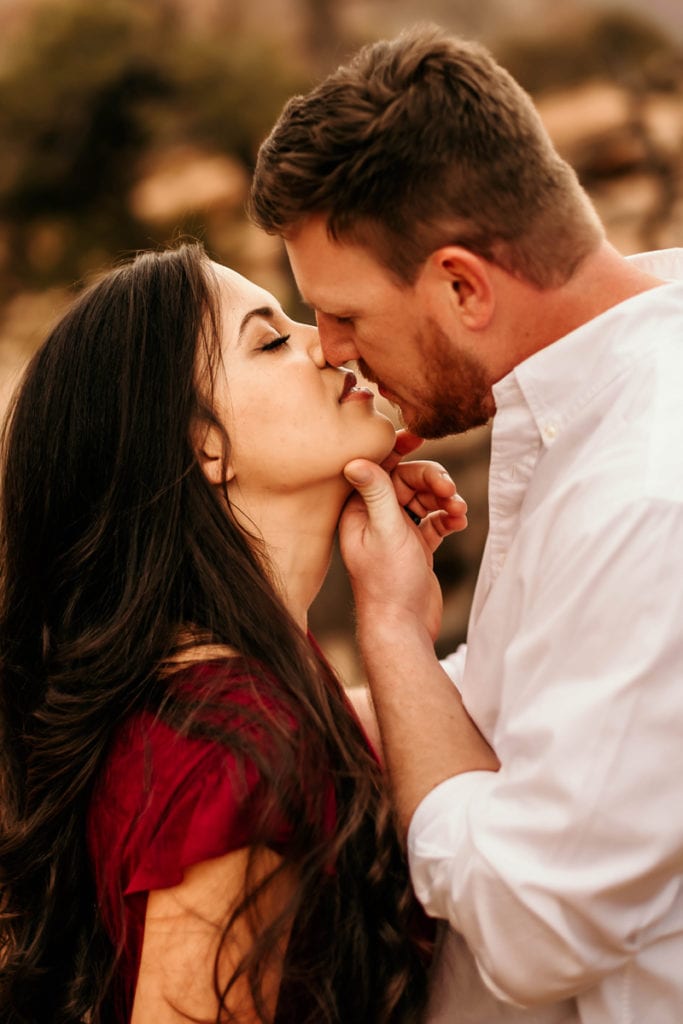 Couples Photographer, a man and woman kiss outside